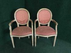 A pair of salon armchairs