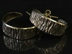 A pair of 9ct gold textured hoop earrings