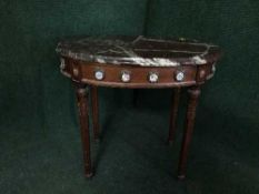 A continental mahogany and marble topped occasional table