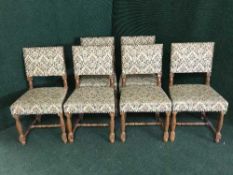 A set of six oak floral upholstered dining chairs