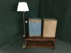A contemporary two tier coffee table together with two Lloyd loom boxes and a standard lamp with