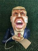 A cast metal money bank - Donald Trump