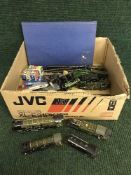 A box of kit built OO gauge trains, carriages,