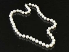 A strand of freshwater pearls with silver clasp