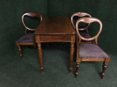 A Victorian inlaid mahogany Pembroke table and three balloon back chairs