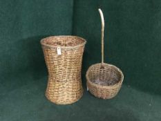 A large wicker laundry basket and a shopping basket