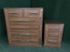 A large contemporary six drawer chest and bedside stand