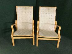 A pair of beech armchairs with webbing upholstery