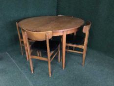 A mid 20th century six piece teak dining room suite