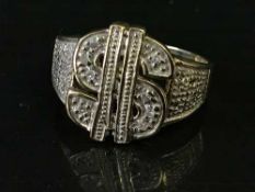 A 9ct gold diamond set dollar ring, 4.9g.