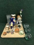 A tray of glass paperweights, etched lighter, toby jug,
