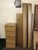 A contemporary oak 4'6 bed frame and a pair of bedside chests