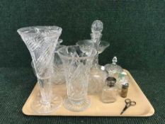 A tray of decanters, paperweight, vases, crystal lidded dish,