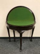 A Georgian style mahogany d-shaped card table