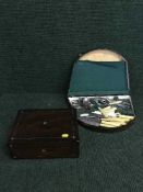 An antique rosewood jewellery box and oak canteen of cutlery