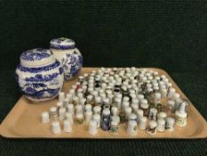 A tray of two Masons lidded ginger jars and quantity of china thimbles