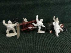 A cast metal figure - Michelin man in plane,