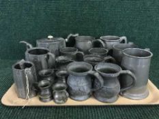 A large quantity of pewter tankards, tea service,