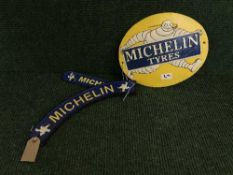 Three cast metal Michelin tyres plaques
