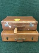 Two mid 20th century brown leather luggage cases