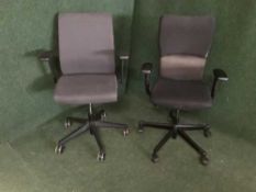 Two swivel office chairs