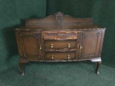 An oak sideboard on pad feet