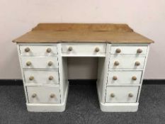 A Victorian style painted dressing table fitted with nine drawers