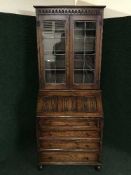 An oak leaded glass door bureau bookcase