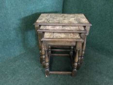 A nest of three oak tiled tables together with a tiled coffee table on Queen Anne legs