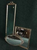A gilt framed hall mirror and two others