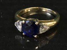 An 18ct gold sapphire and diamond ring,