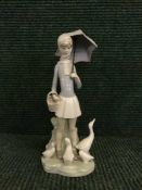 A Lladro figure - girl with parasol