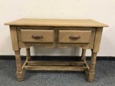A reclaimed pine two drawer hall table