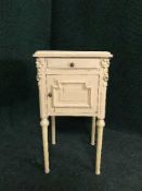 A painted pine marble topped pot cupboard