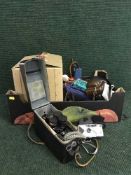 A typewriter and a box of Emgui projector,