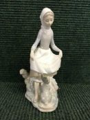 A Lladro figure - girl with rabbit