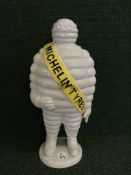 A cast metal figure - Michelin man