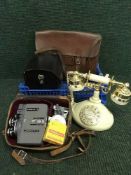 A crate of leather satchel, vintage style telephone,