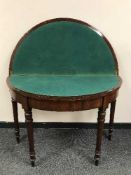 A nineteenth century mahogany d-shaped card table