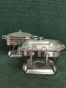 Two chafing dishes on stands with burners