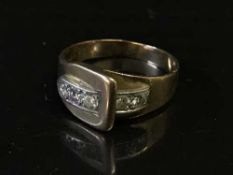 A diamond set buckle ring,