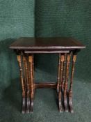 A nest of three inlaid mahogany tables