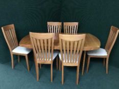 An extending dining table and six chairs