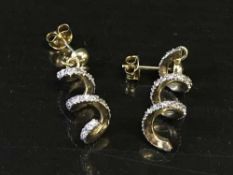 A pair of 9ct gold stone set spiral drop earrings