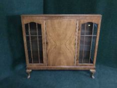 A walnut display cabinet