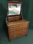 An Edwardian mahogany mirrored dressing chest
