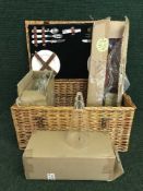 A pine dressing table stool and a picnic hamper containing candle holders