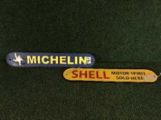 Two cast metal plaques - Shell motor spirit and Michelin tyres
