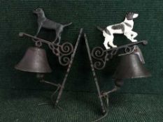 Two cast metal wall brackets with bells (dogs)