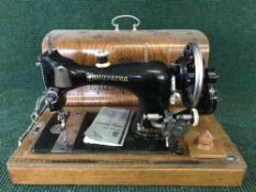 An oak cased Husqvarna hand sewing machine